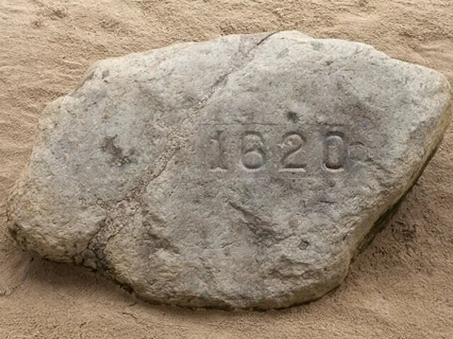 Close-up of Plymouth Rock with the year 1620 carved into it.